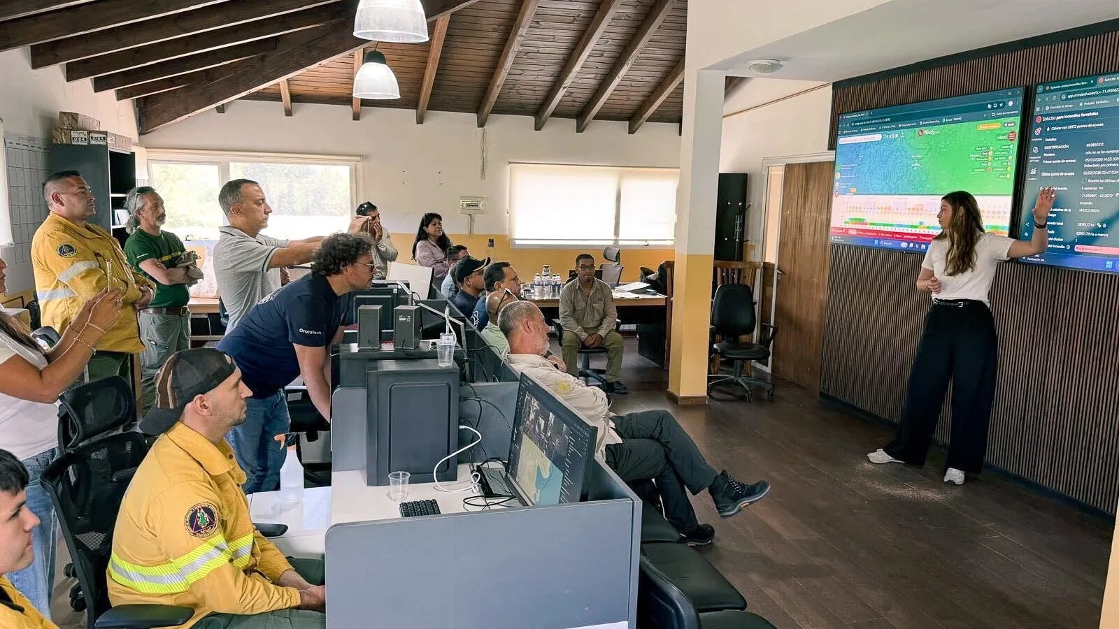 Emergency response personnel observe a demonstration of OroraTech’s real-time wildfire intelligence platform